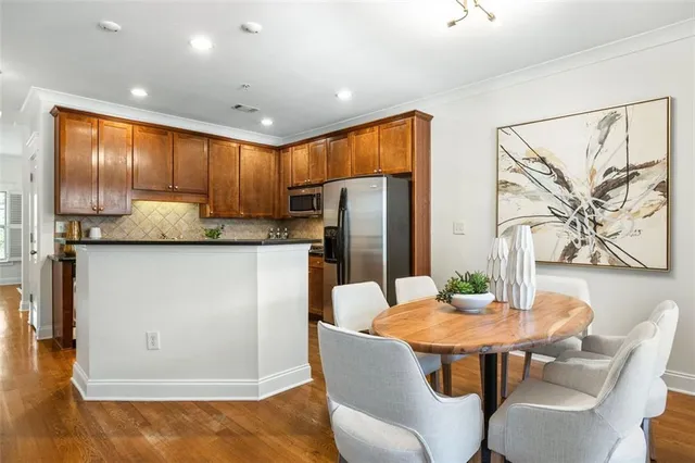 a kitchen with granite countertop cabinets and refrigerator