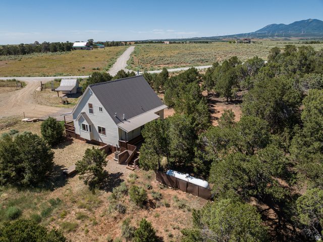 684 Blue Mountain Ridge Monticello, UT 84535 - Photo 10 of 71 Aerial view of property and surrounding area with a mountain backdrop