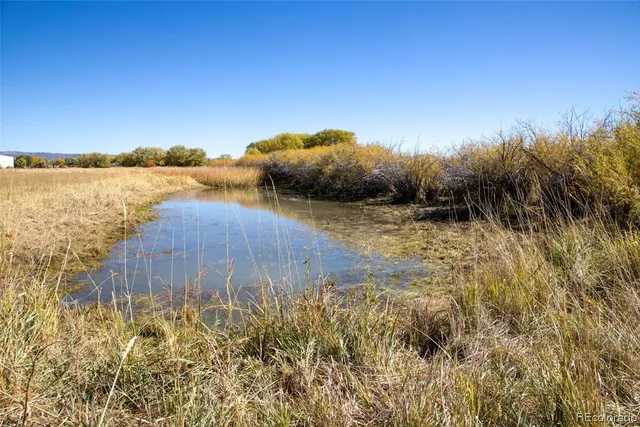 a view of a lake with a big yard