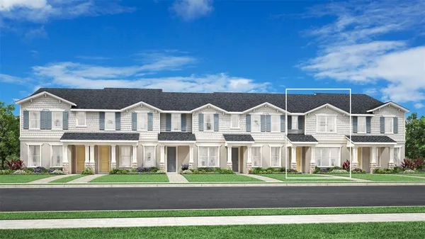 a view of a big house with a big yard and large trees