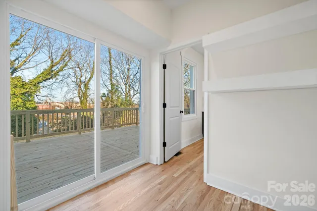 a bathroom with a sink mirror and shower