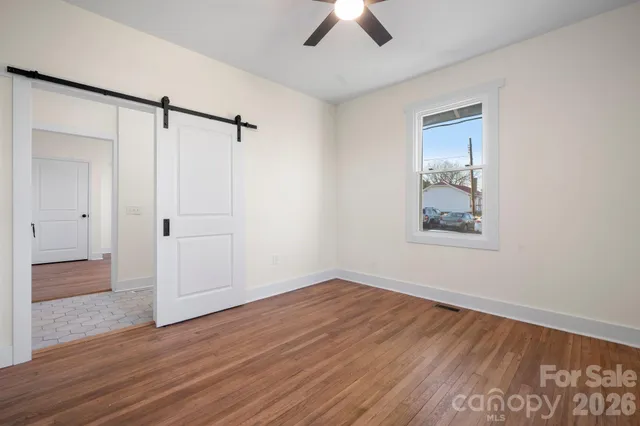 a view of a room with wooden walls