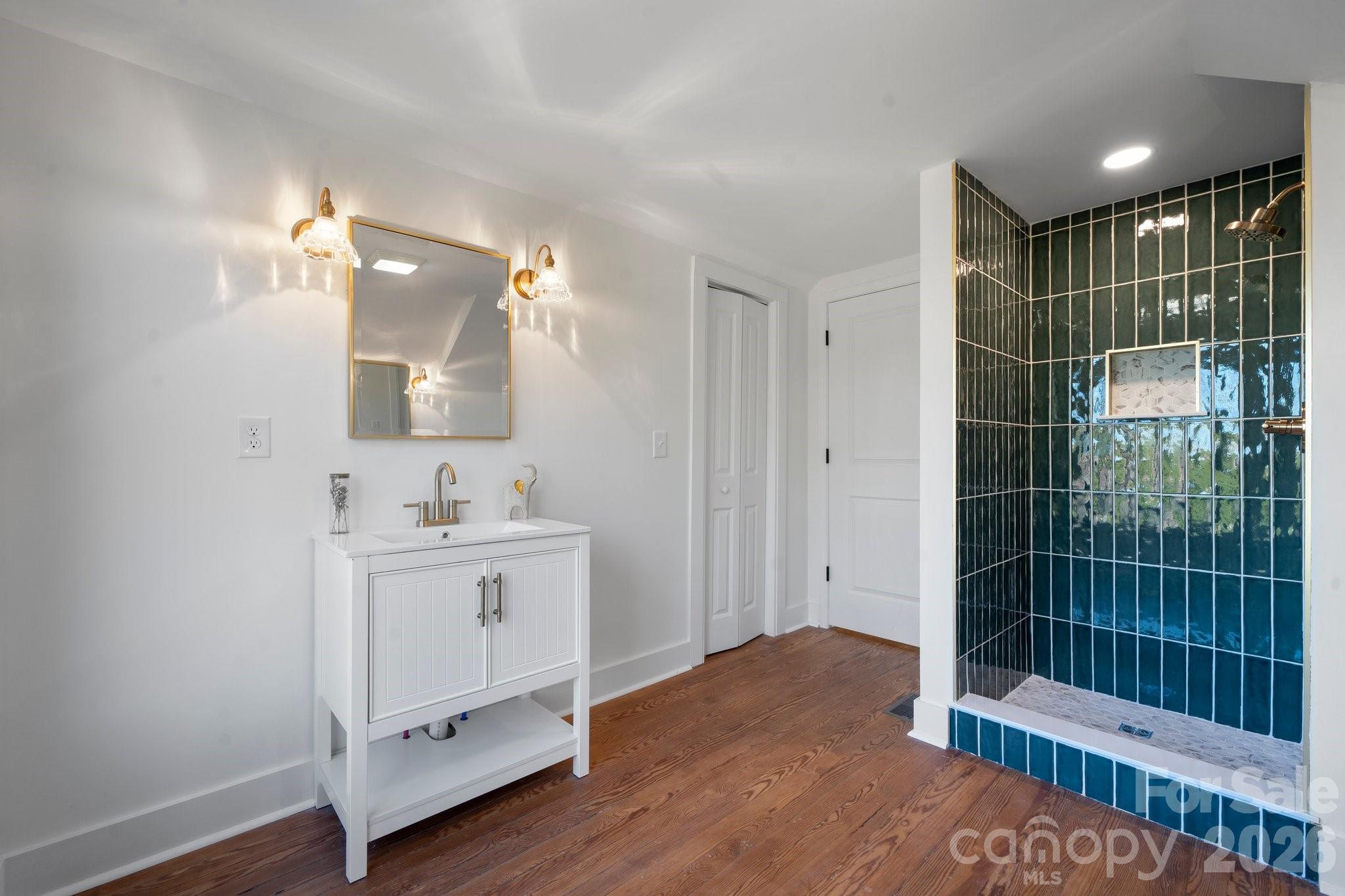 49 8th Street Southeast Hickory, NC 28602 - Photo 28 of 39 a bathroom with a sink vanity and a mirror
