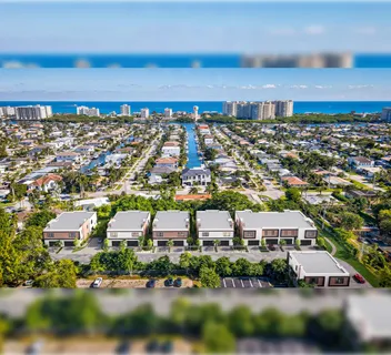 an aerial view of residential building with parking