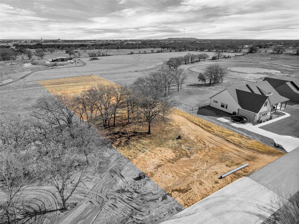 2203 Rattler Way Tolar, TX 76476 - Photo 2 of 7 a view of a lake with beach