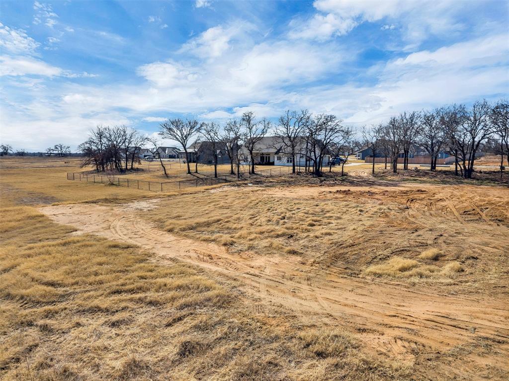 2203 Rattler Way Tolar, TX 76476 - Photo 4 of 7 a view of a yard with an ocean