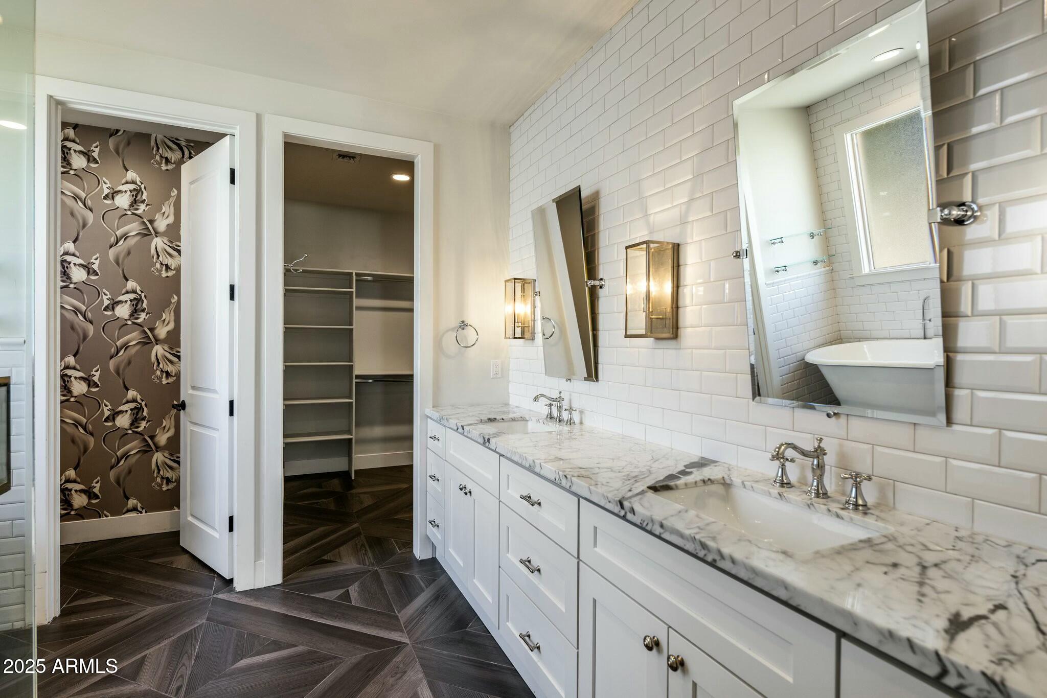 3902 East Fairmount Avenue Phoenix, AZ 85018 - Photo 15 of 32 a bathroom with a granite countertop sink and a mirror