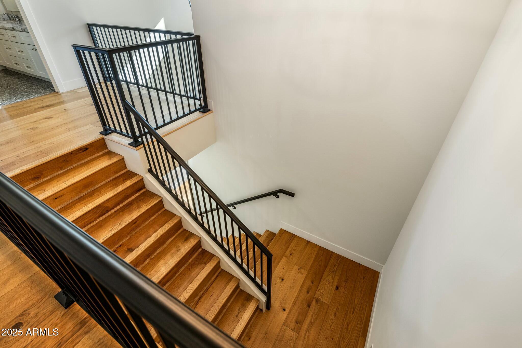 3902 East Fairmount Avenue Phoenix, AZ 85018 - Photo 22 of 32 a view of staircase with white walls and railing