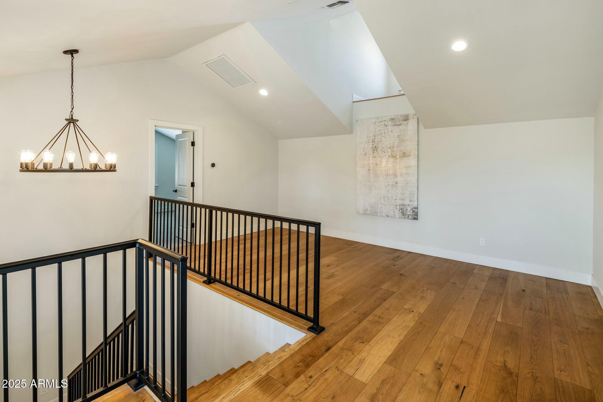 3902 East Fairmount Avenue Phoenix, AZ 85018 - Photo 23 of 32 a view of a hallway with wooden floor