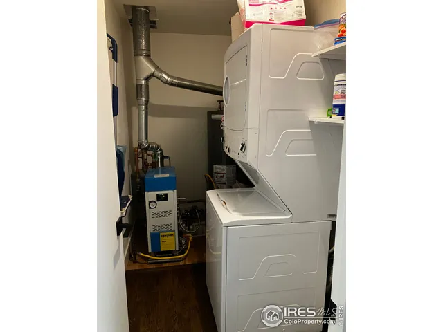 a view of a house with a backyard and a patio