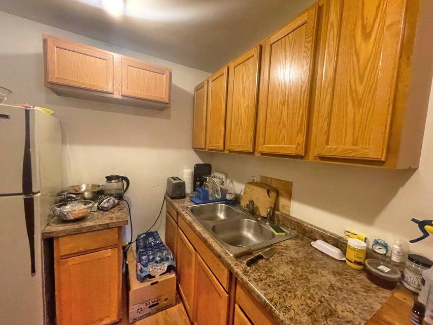 2565 Rockydale Road Cave Junction, OR 97523 - Photo 5 of 14 a kitchen with granite countertop a sink stove and cabinets