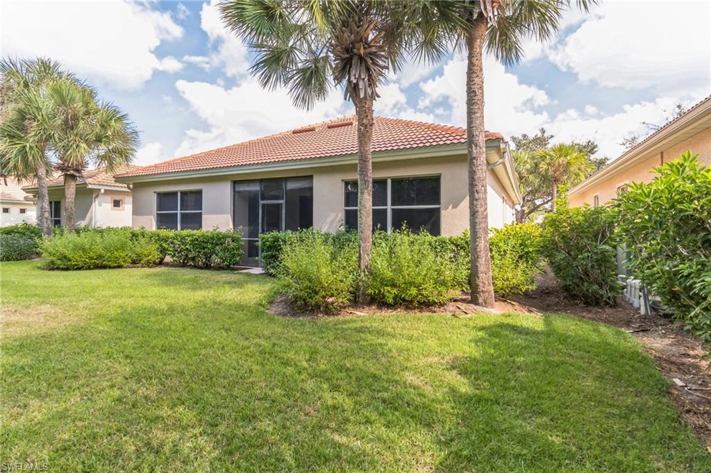 7849 Founders Lane Naples, FL 34104 - Photo 23 of 23 a view of a yard in front of a house