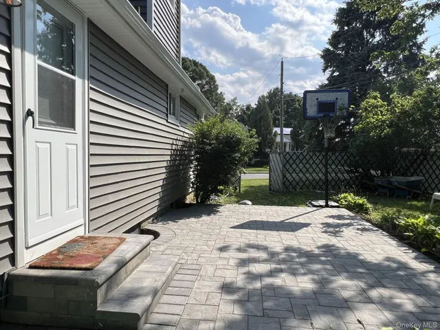 a backyard of a house with yard and garage