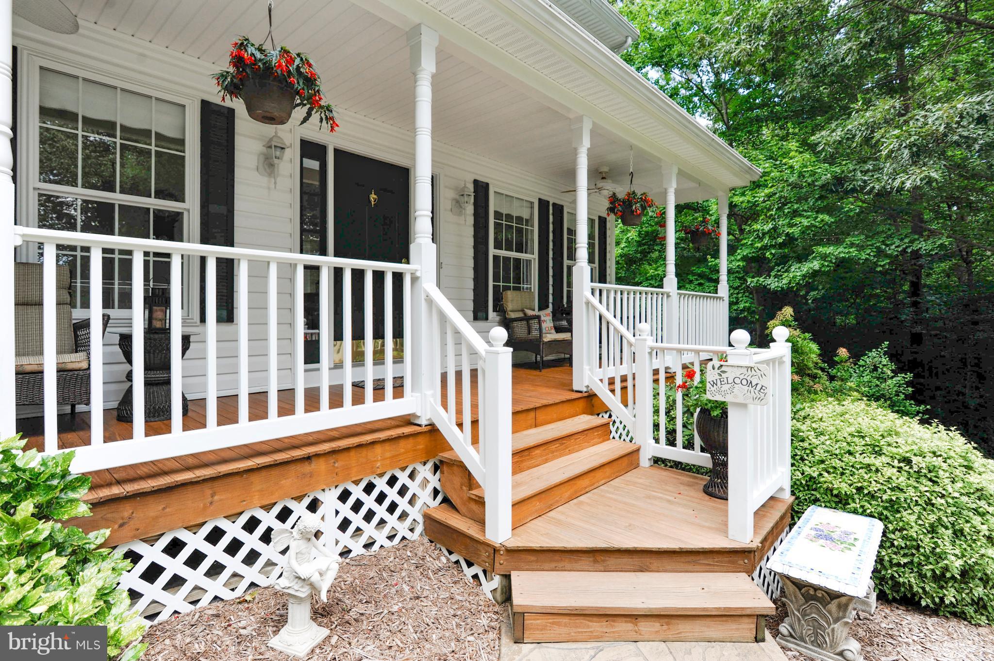 2816 Stinnett Road Huntingtown, MD 20639 - Photo 1 of 27 a balcony view with a garden