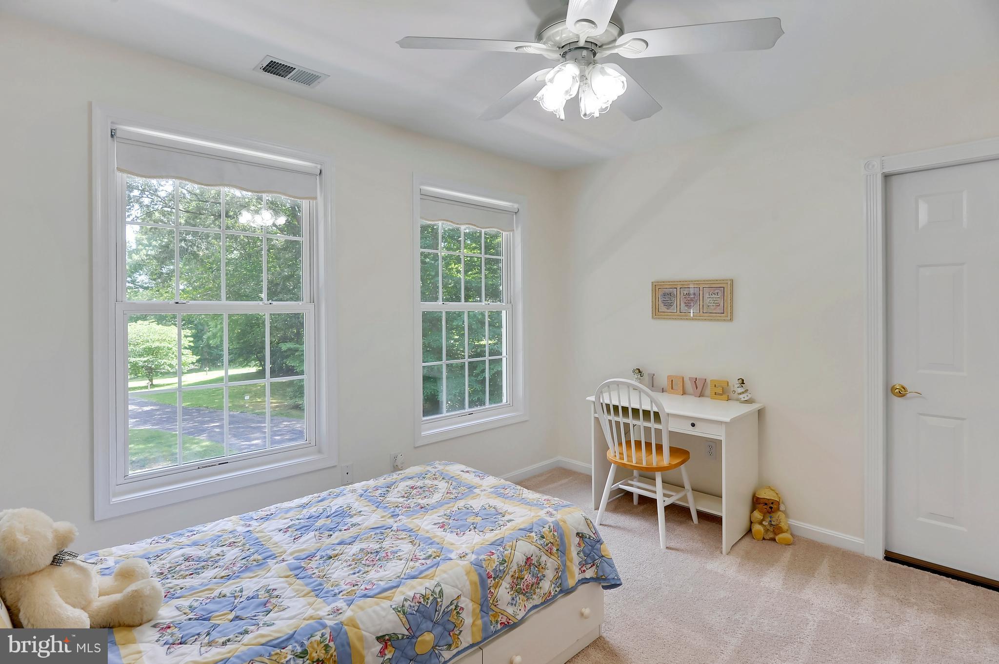 2816 Stinnett Road Huntingtown, MD 20639 - Photo 12 of 27 a bedroom with a bed and a window