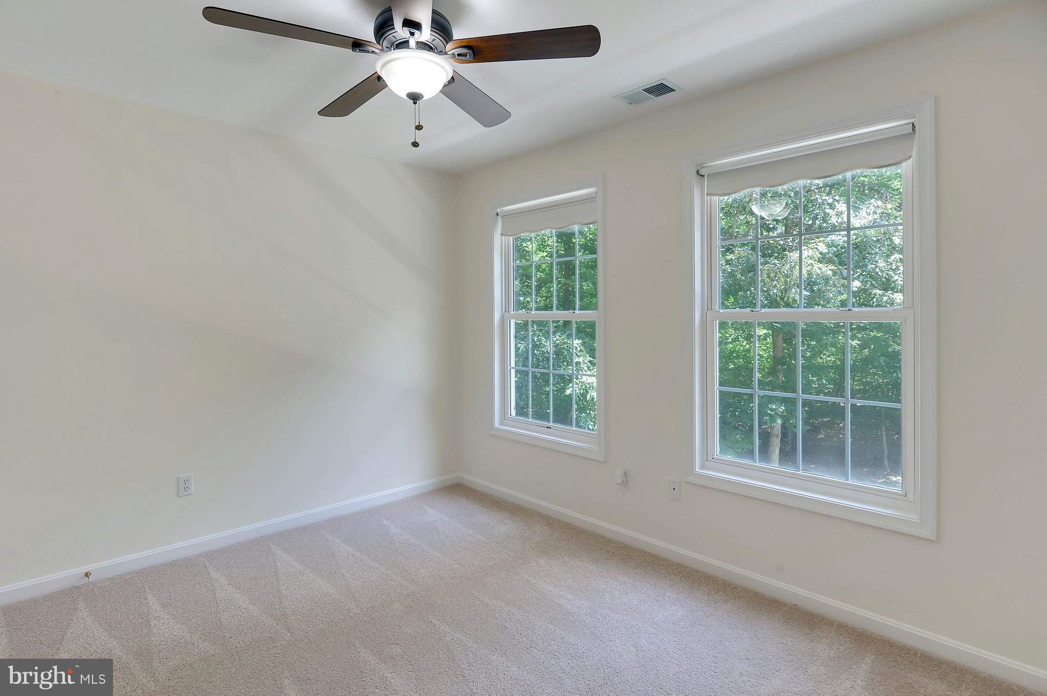 2816 Stinnett Road Huntingtown, MD 20639 - Photo 13 of 27 a view of room with window and ceiling fan