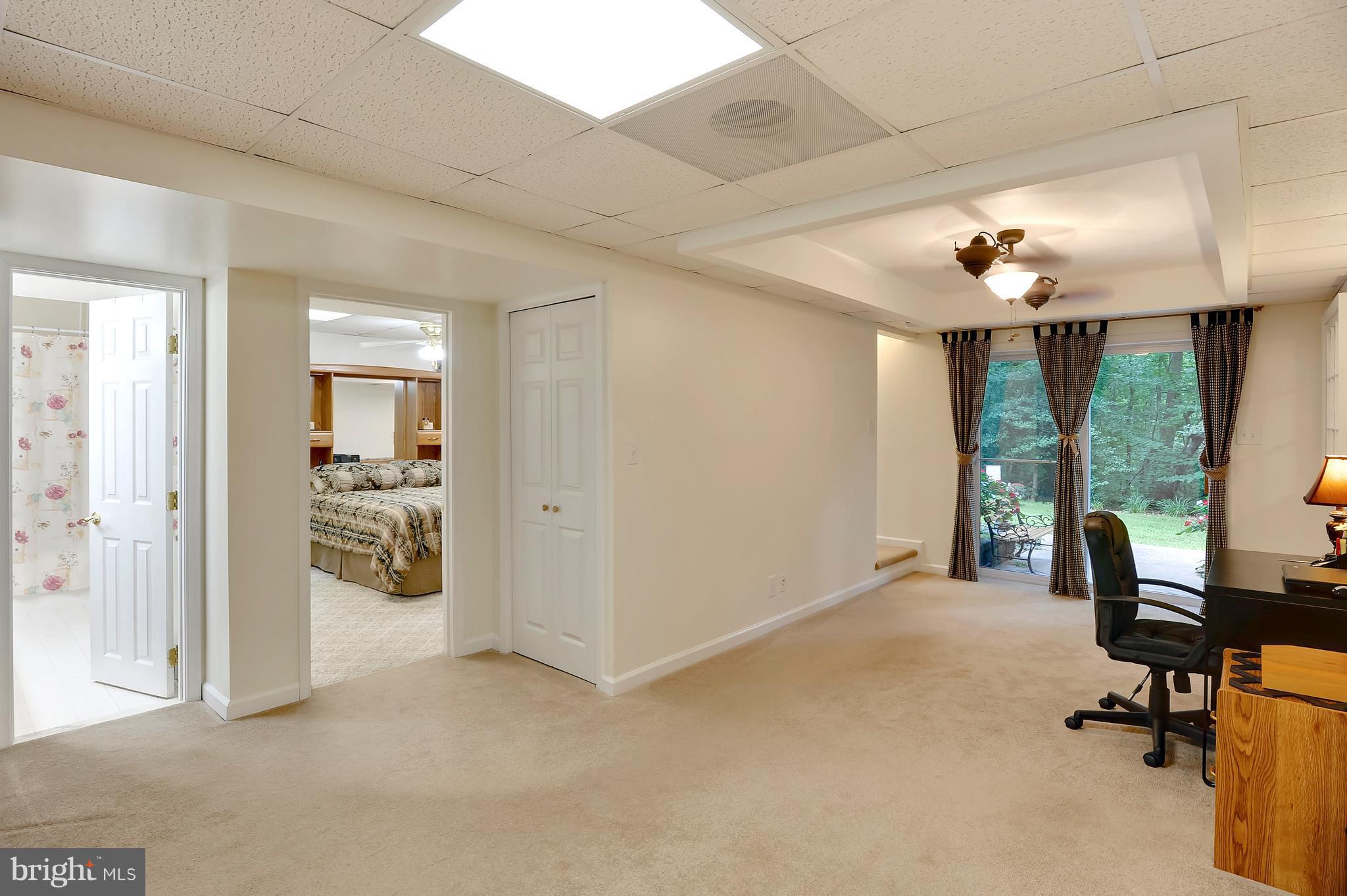 2816 Stinnett Road Huntingtown, MD 20639 - Photo 14 of 27 a view of a livingroom with a furniture and floor to ceiling window
