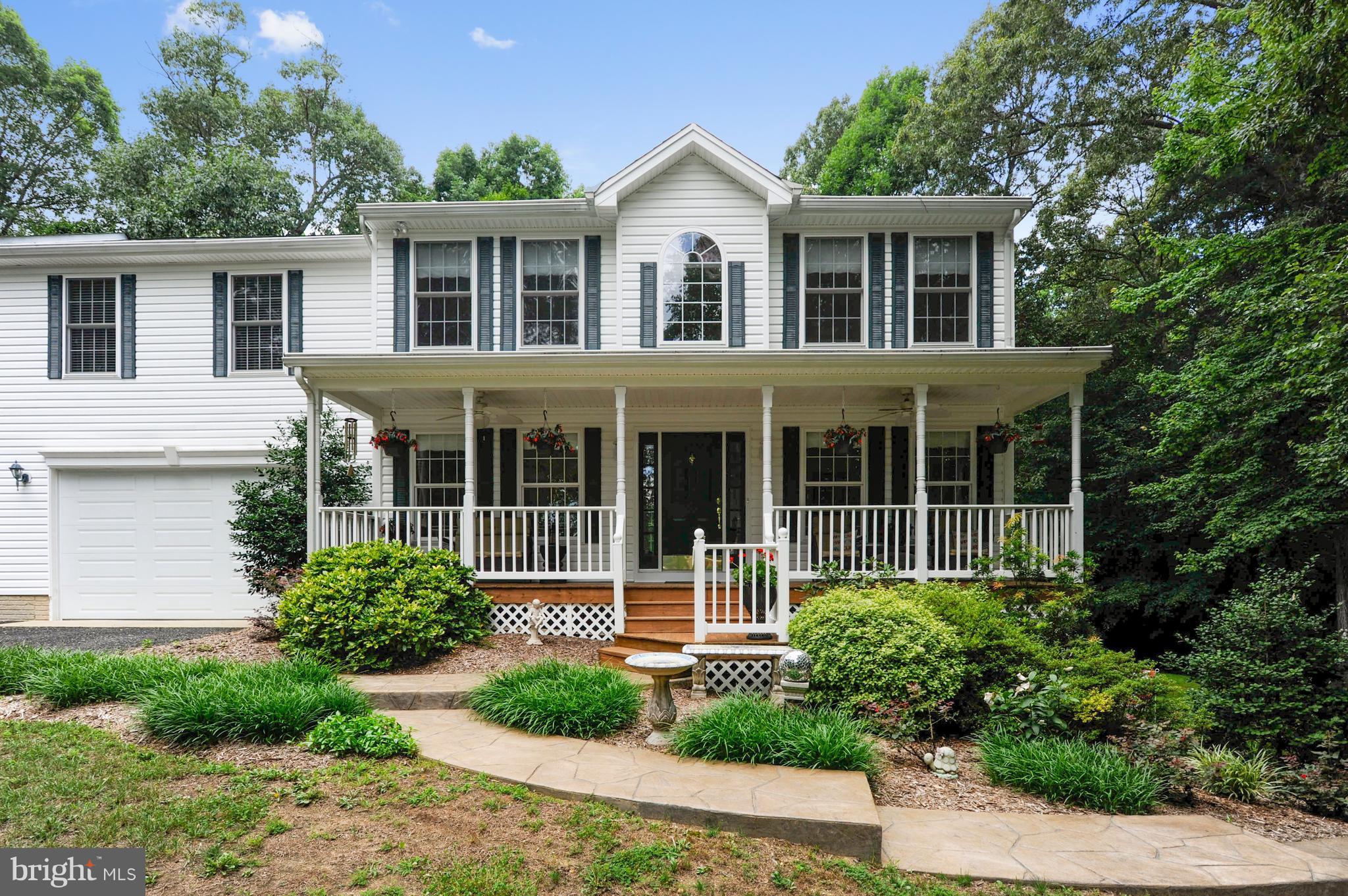 2816 Stinnett Road Huntingtown, MD 20639 - Photo 24 of 27 a house view with a garden space