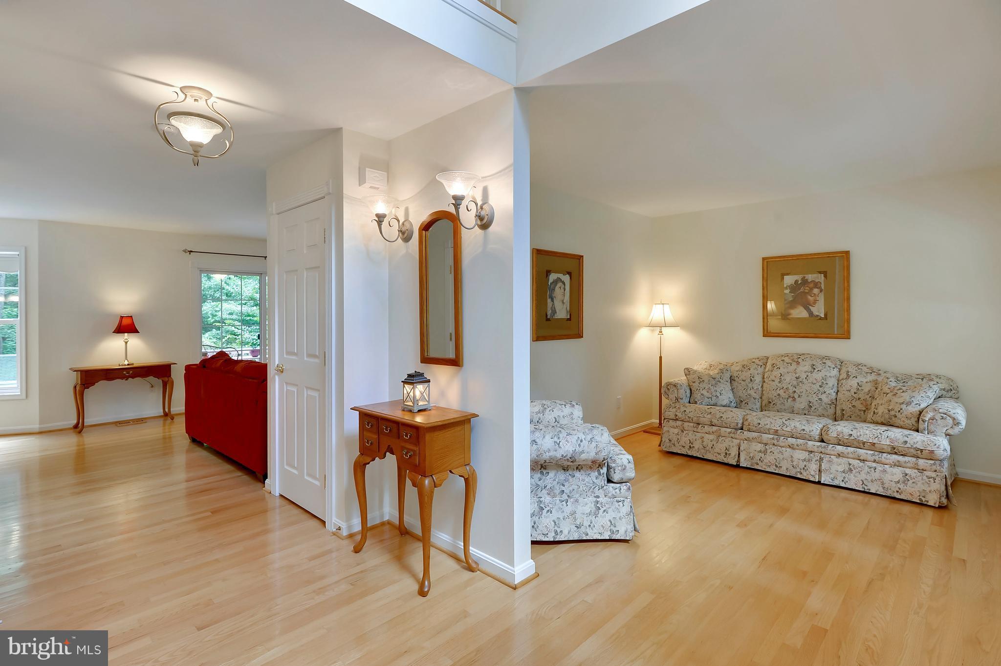 2816 Stinnett Road Huntingtown, MD 20639 - Photo 5 of 27 a living room with furniture and a wooden floor
