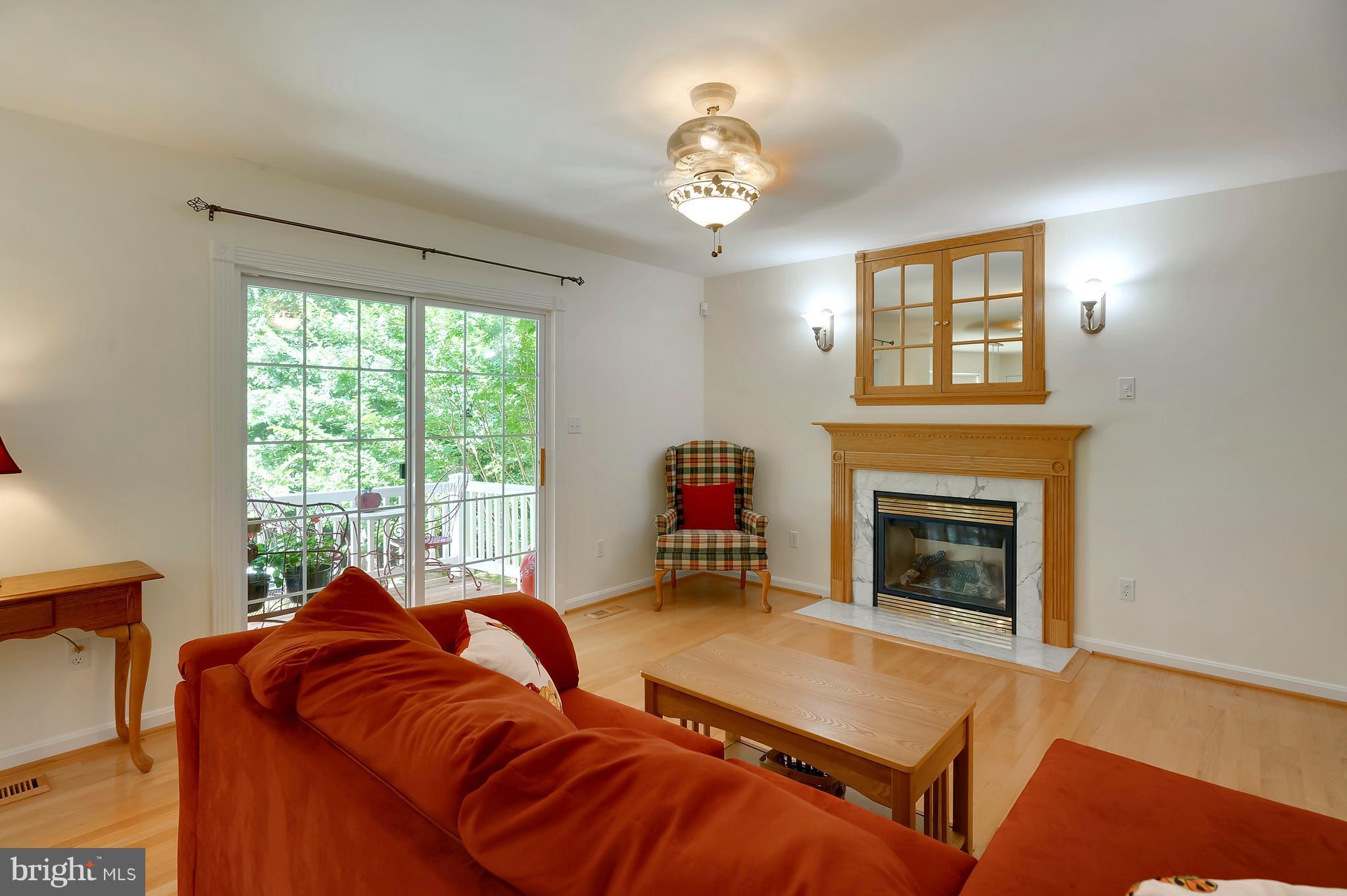 2816 Stinnett Road Huntingtown, MD 20639 - Photo 6 of 27 a bedroom with furniture and a fireplace