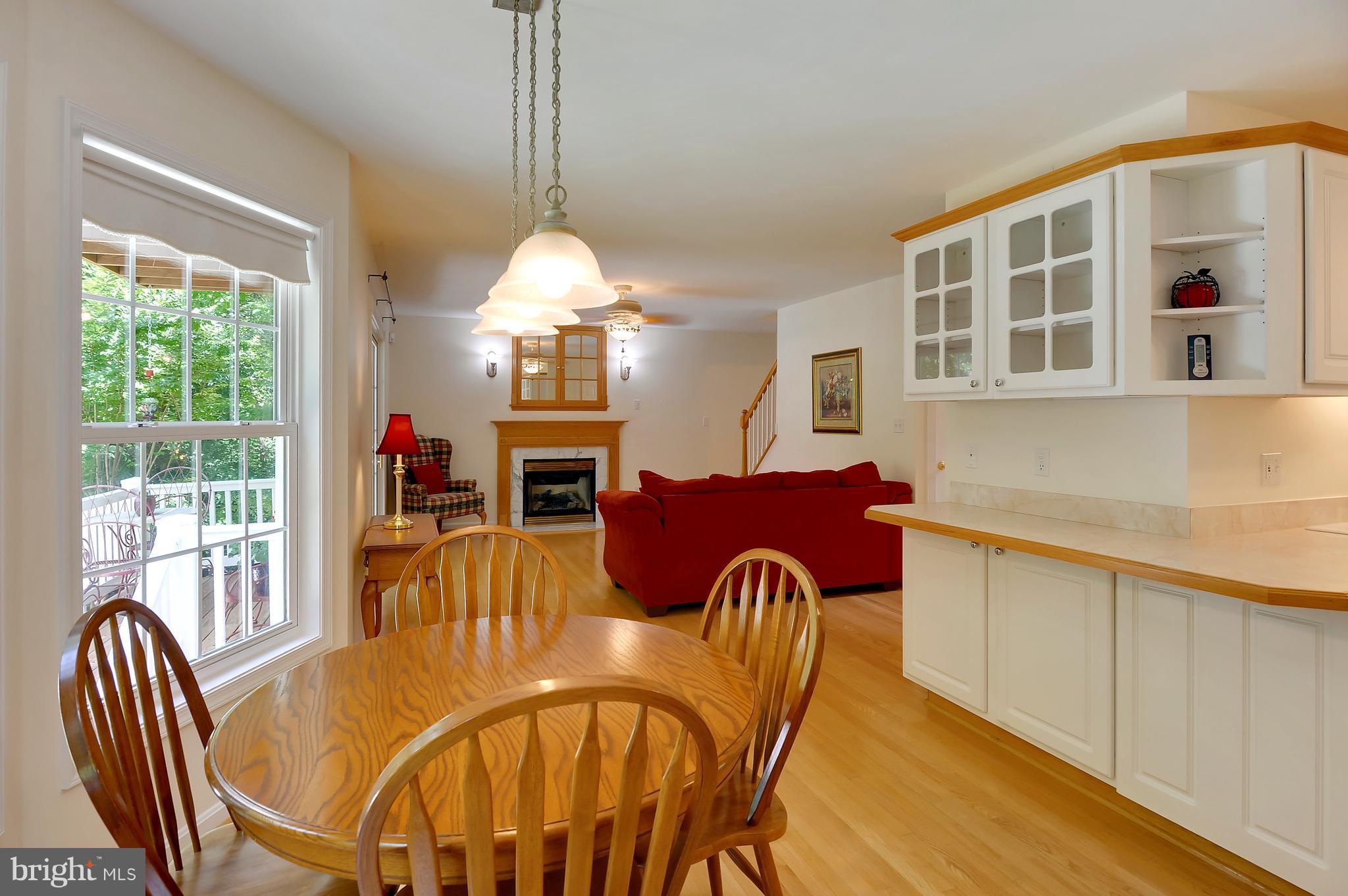 2816 Stinnett Road Huntingtown, MD 20639 - Photo 7 of 27 a view of a dining room with furniture window and wooden floor