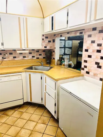 a view of a kitchen with utility and utility room