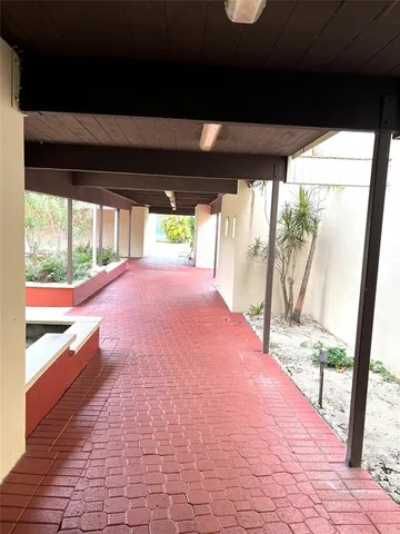 a view of a porch and garden