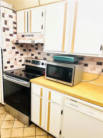 a kitchen with a stove and a microwave