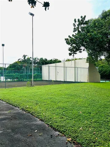 a view of a garden with a pole