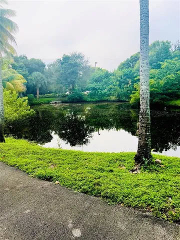 a view of a lake with a house in the background