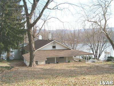 7749 Depues Ferry Road Bangor, PA 18013 - Photo 1 of 12 view of home, wrap around covered porch, & Delaware River
