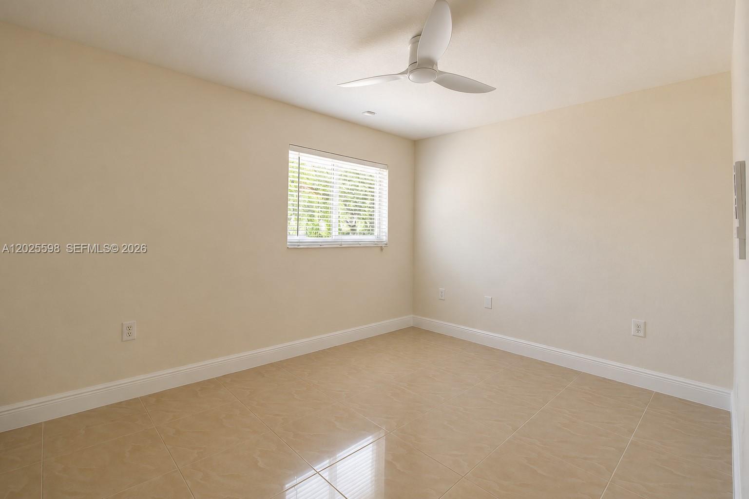 9421 Southwest 150th Street Miami, FL 33176 - Photo 15 of 31 an empty room with a window
