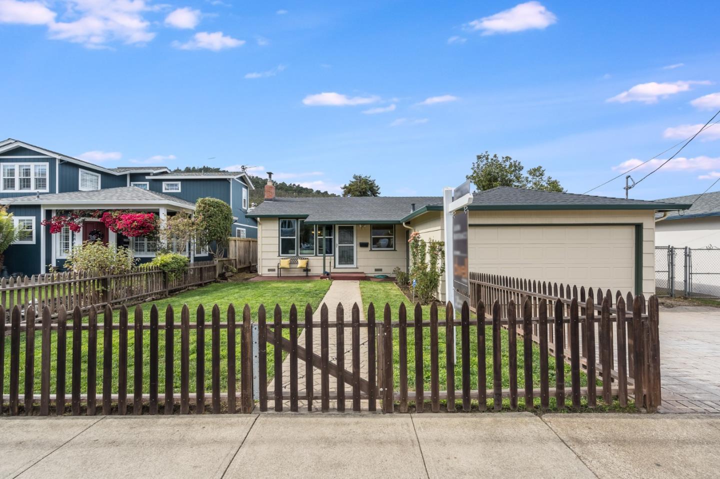 1376 Peralta Road Pacifica, CA 94044 - Photo 2 of 35 a front view of a house with a garden