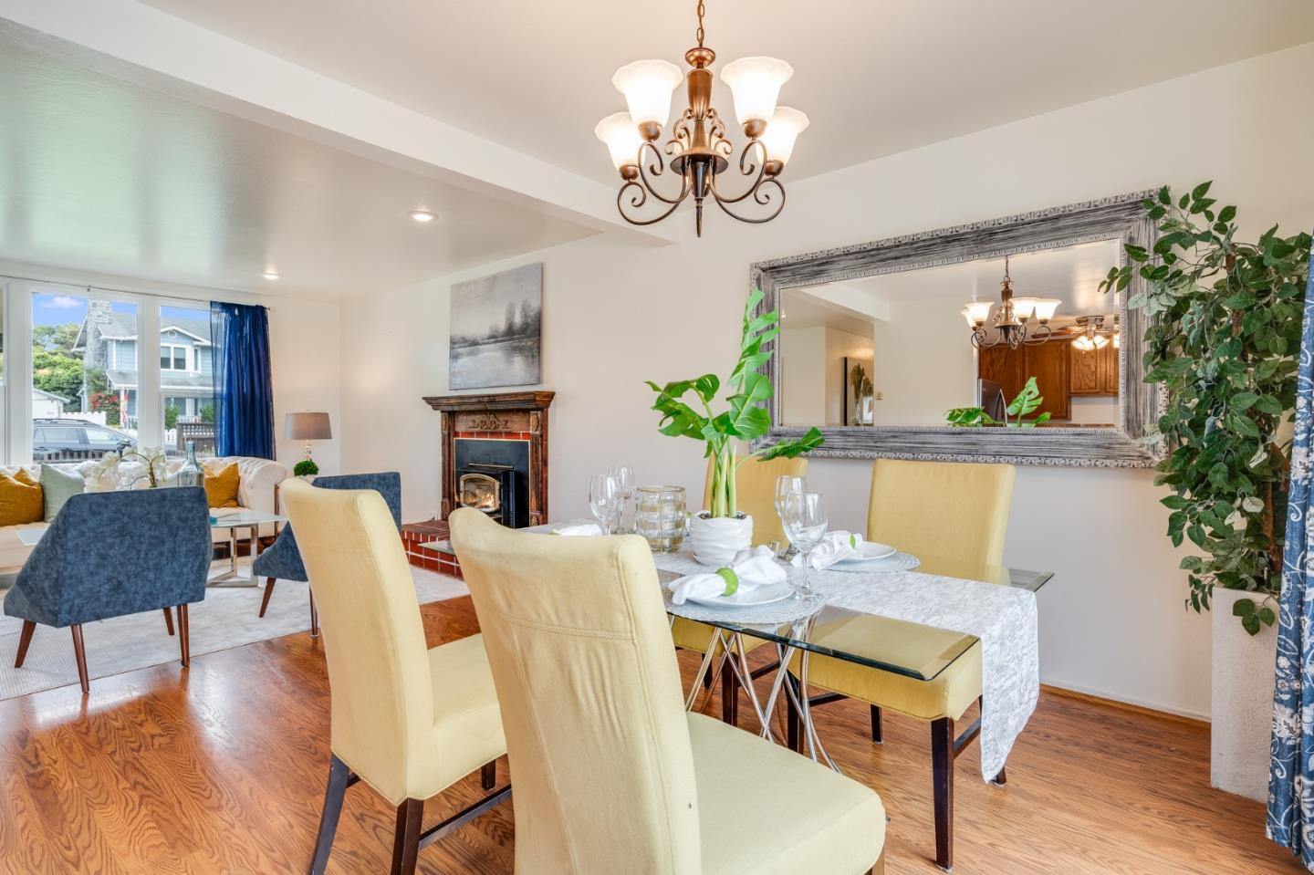 1376 Peralta Road Pacifica, CA 94044 - Photo 12 of 35 a view of a dining room with furniture wooden floor and chandelier