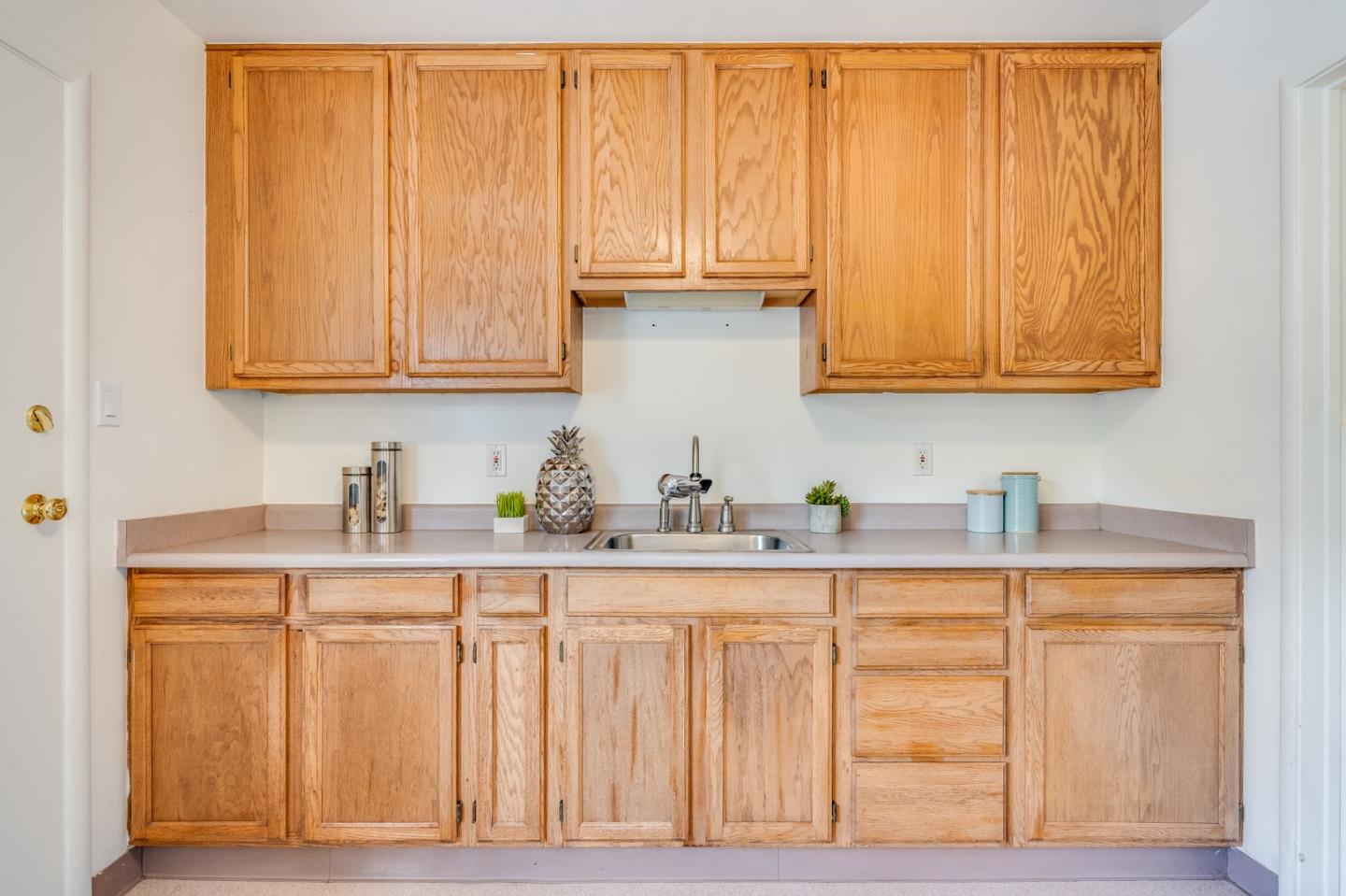1376 Peralta Road Pacifica, CA 94044 - Photo 15 of 35 a kitchen with granite countertop wooden cabinets