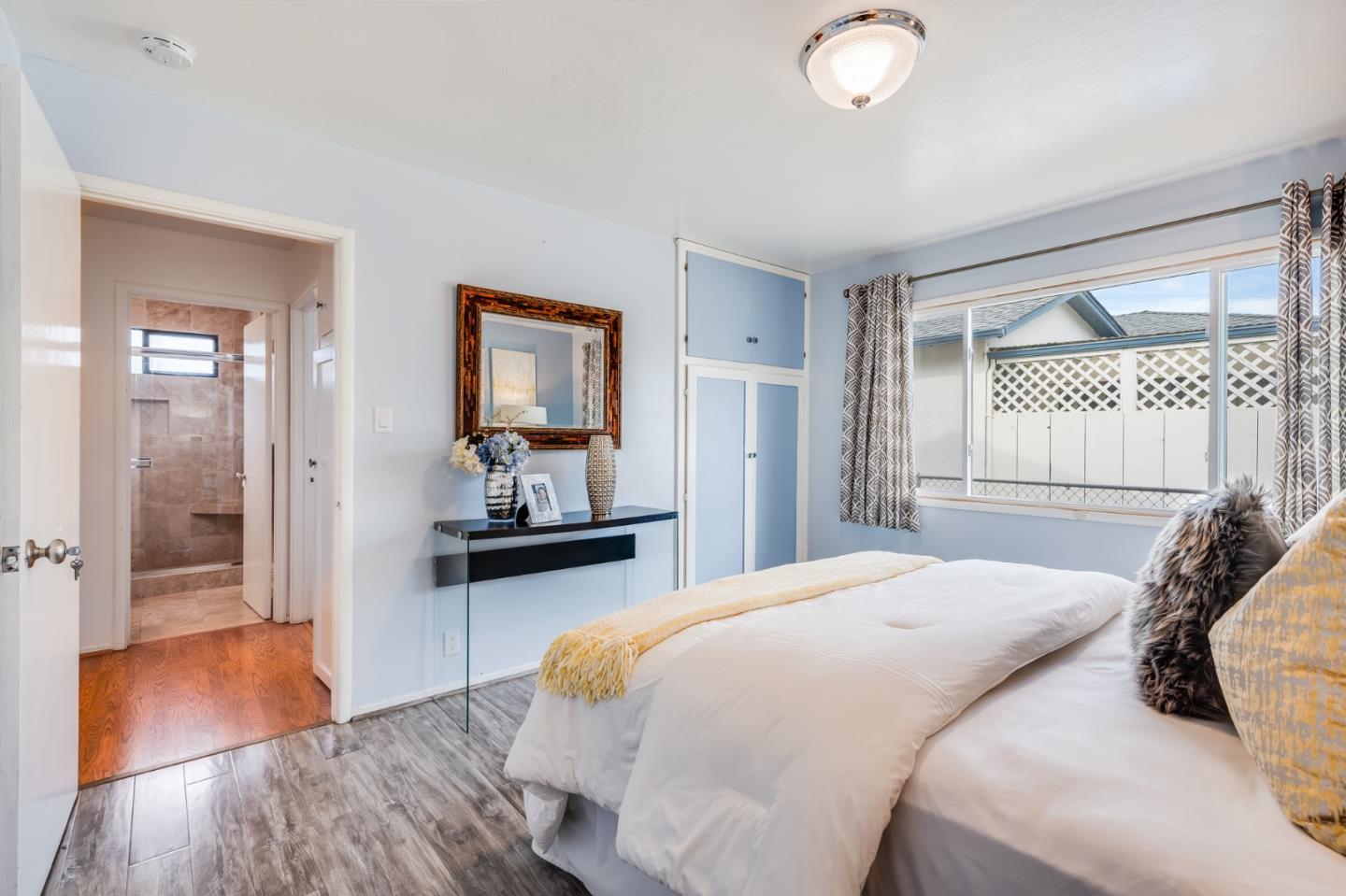 1376 Peralta Road Pacifica, CA 94044 - Photo 18 of 35 a bedroom with a bed and a dresser