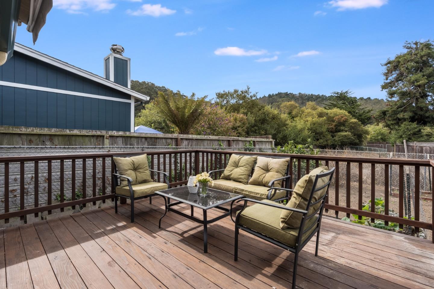 1376 Peralta Road Pacifica, CA 94044 - Photo 25 of 35 a balcony with wooden floor and outdoor seating