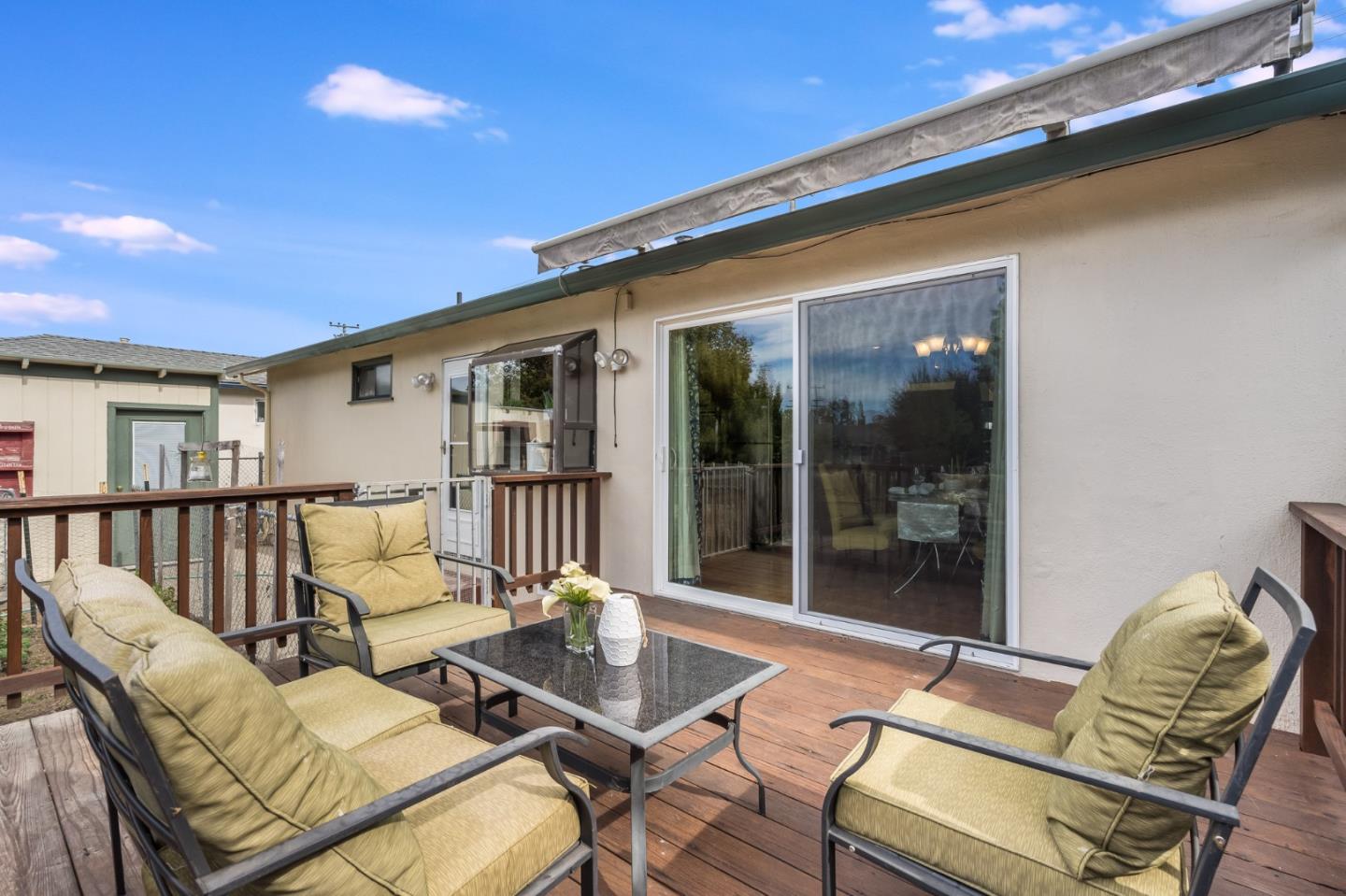 1376 Peralta Road Pacifica, CA 94044 - Photo 26 of 35 a view of a patio with couches table and chairs and potted plants