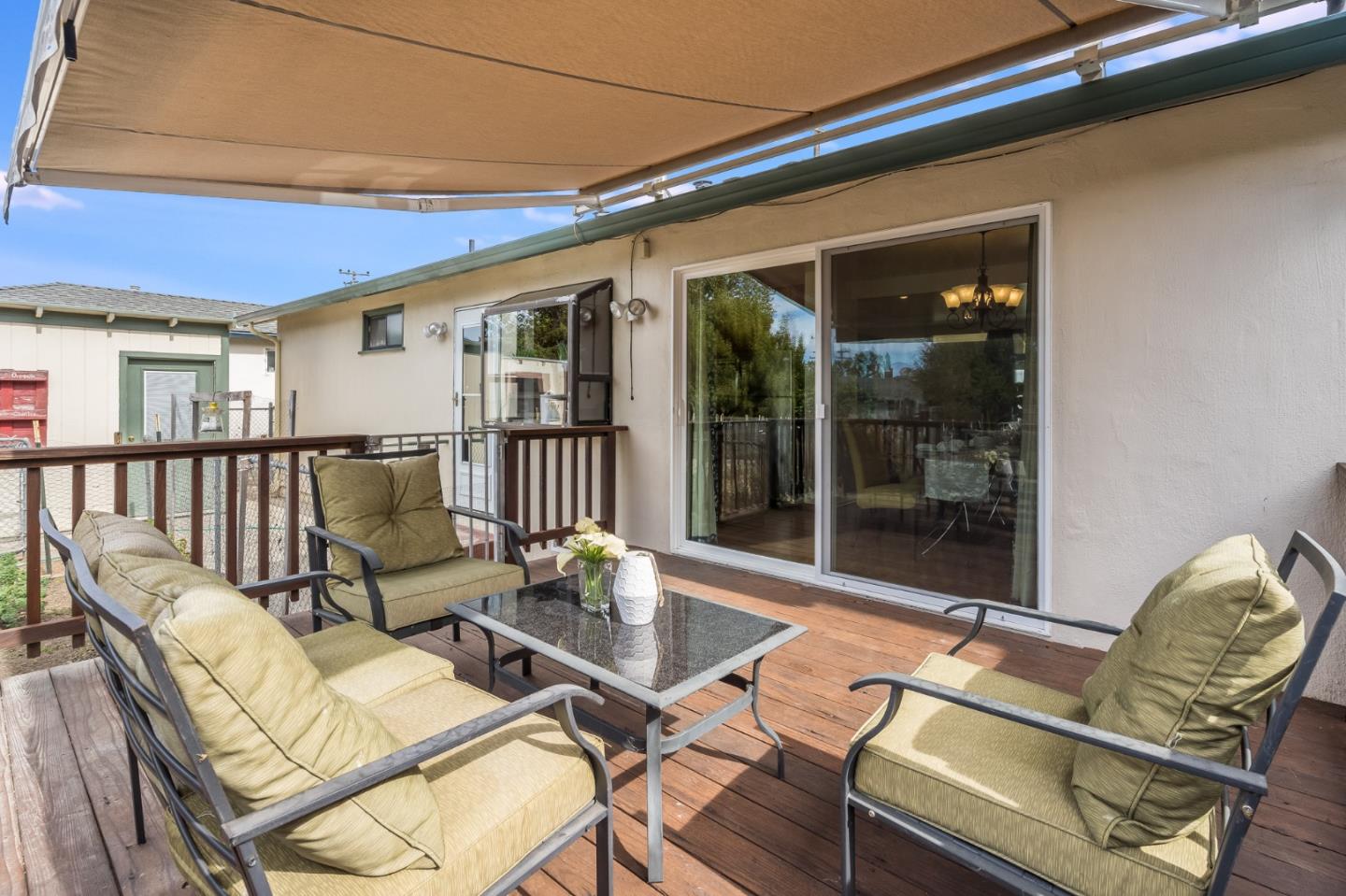 1376 Peralta Road Pacifica, CA 94044 - Photo 27 of 35 a view of a patio with couches table and chairs and potted plants