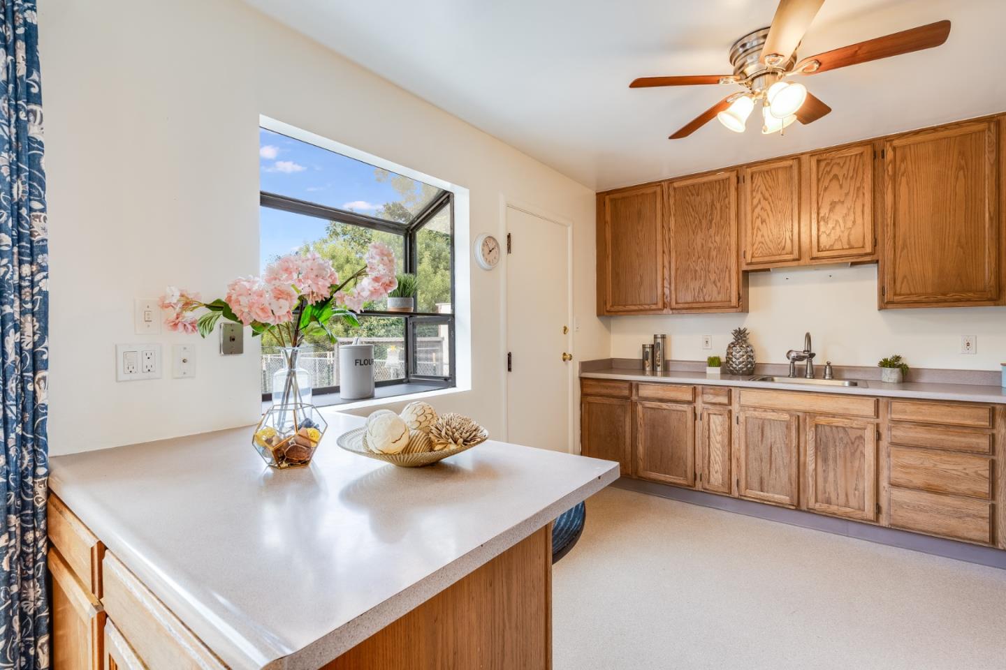 1376 Peralta Road Pacifica, CA 94044 - Photo 4 of 35 a kitchen with stainless steel appliances a sink a stove a refrigerator cabinets and a window