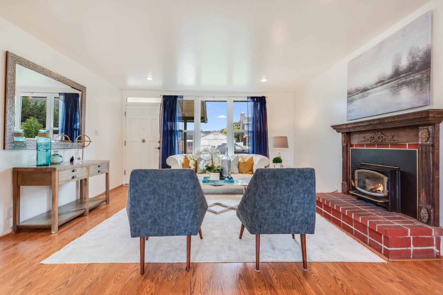 1376 Peralta Road Pacifica, CA 94044 - Photo 5 of 35 a living room with furniture and a fireplace