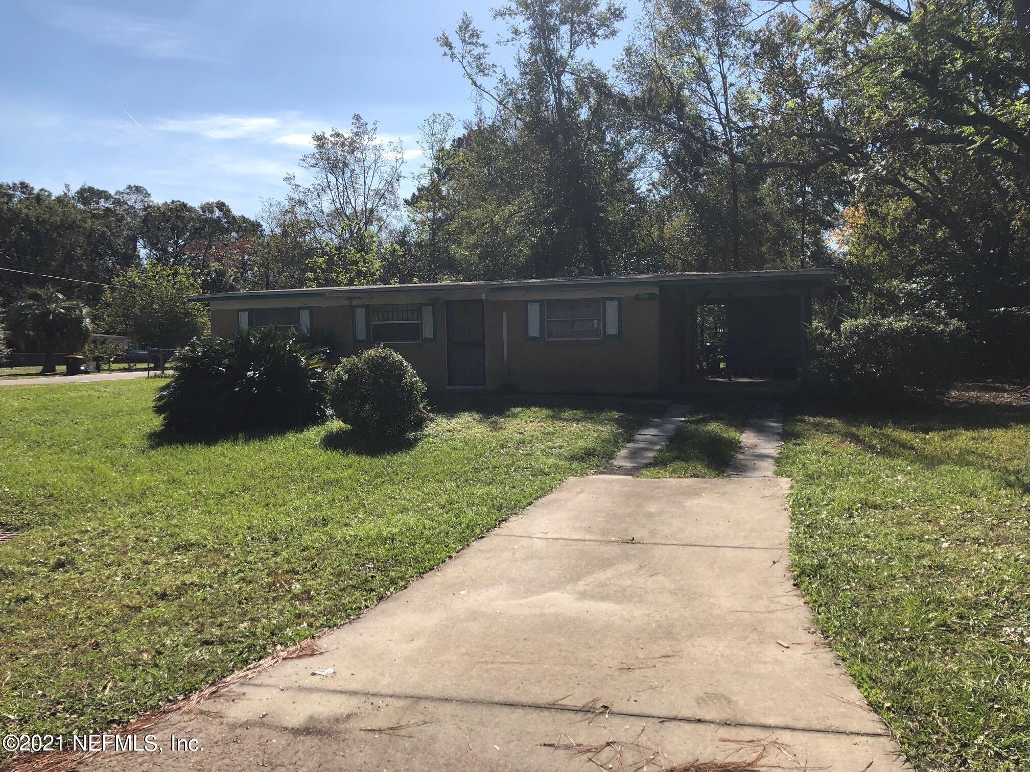 a backyard of a house with lots of green space