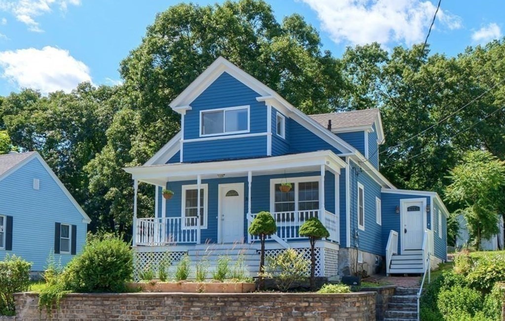 142 East Meadow Road Lowell, MA 01854 - Photo 2 of 28 a front view of a house with porch