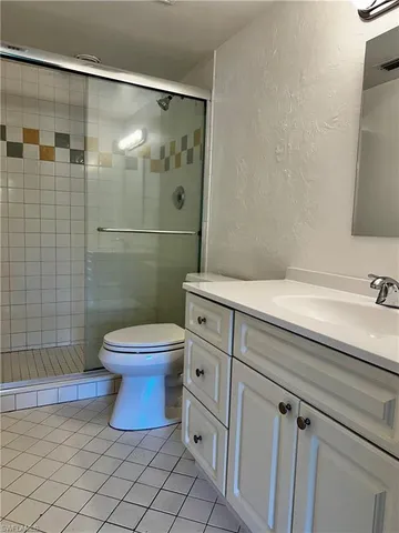 a view of a hallway with wooden shelves