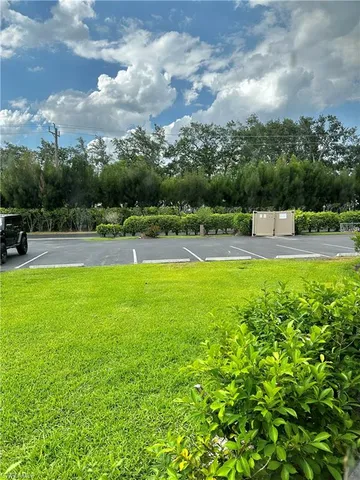 a view of a swimming pool with a yard