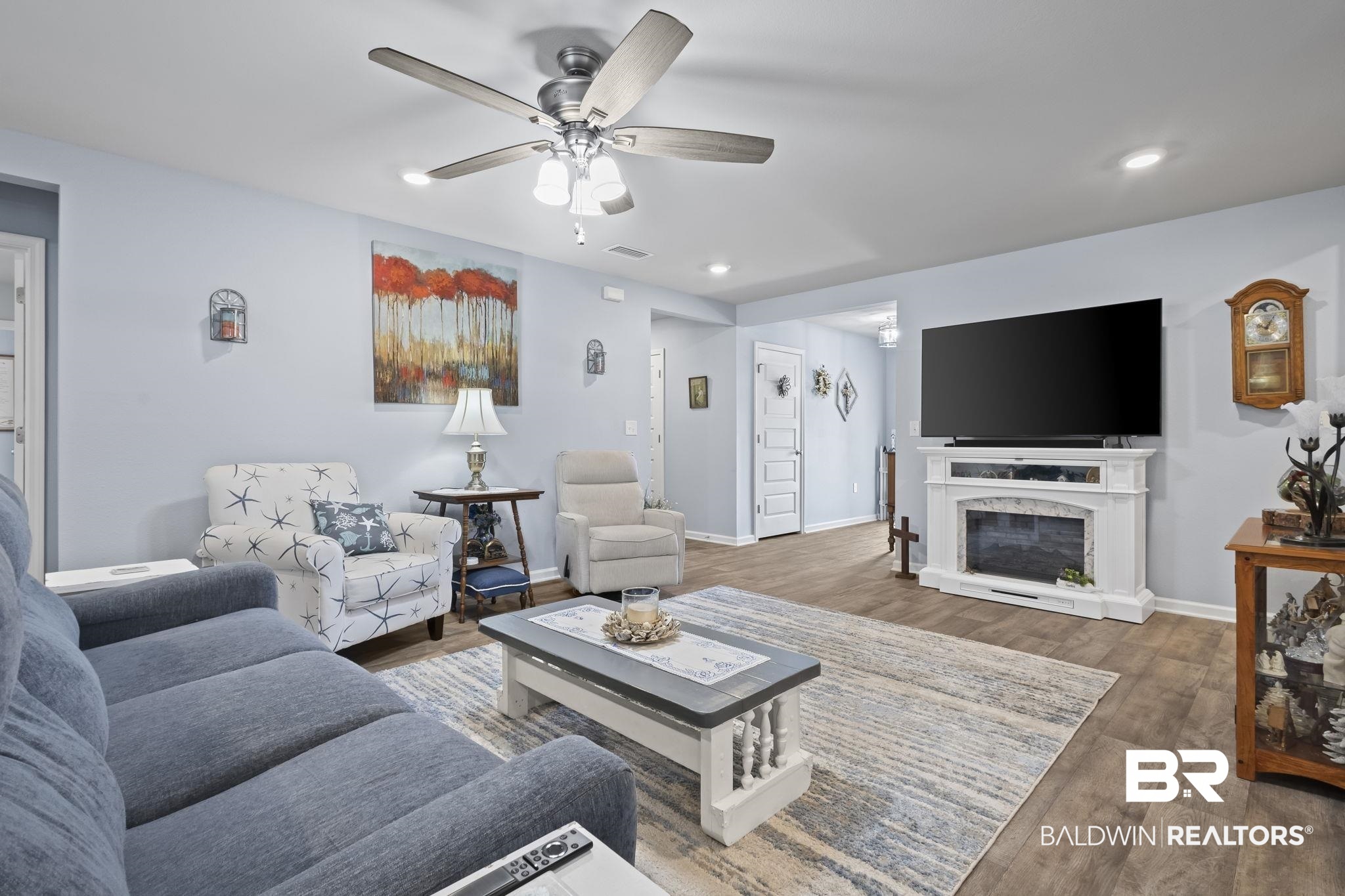 345 Hartenstein Road Foley, AL 36535 - Photo 34 of 47 Living room with ceiling fan and dark wood-type flooring