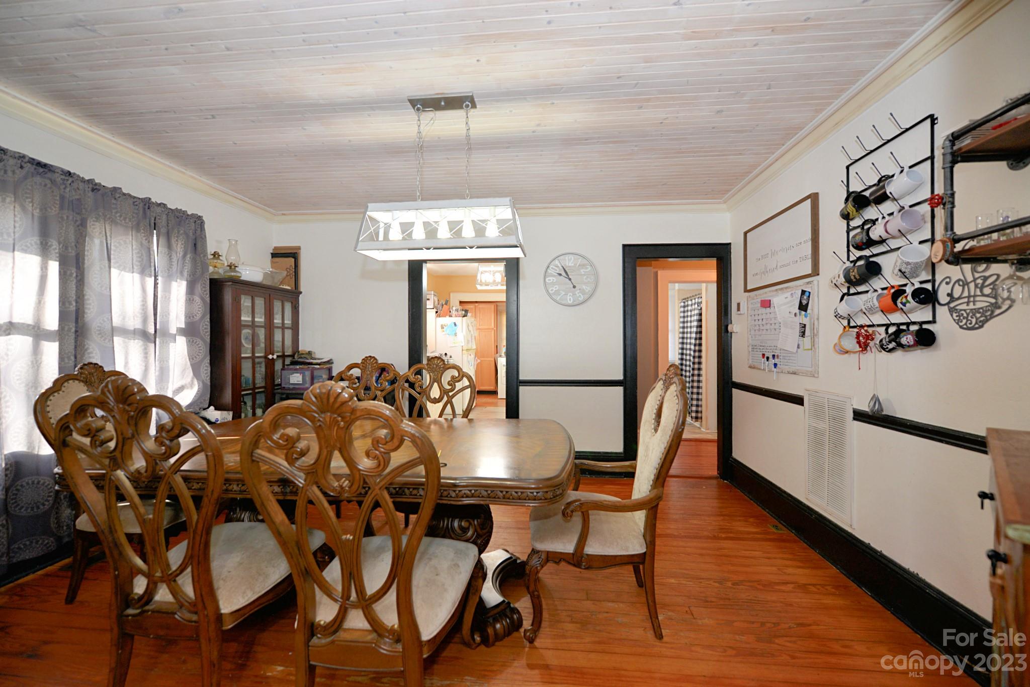 160 Edwards Road Clyde, NC 28721 - Photo 5 of 17 a view of a dining room with furniture and chandelier