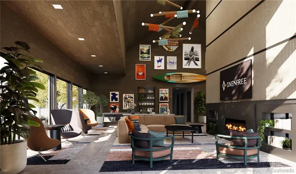 a living room with furniture gym equipment and a large window