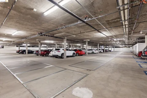 a view of parking space with cars parked