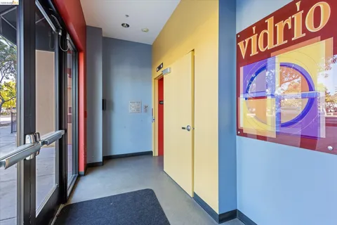 a view of a street with paintings on the wall